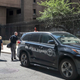 New York City medical examiner personnel walk to the Manhattan Correctional Center where financier Jeffrey Epstein died by suicide while awaiting trial on sex-trafficking charges, Saturday Aug. 10, 2019, in New York